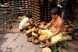 Ban Bat in the centre of Bangkok's old Ratanakosin area still produces handmade alms bowls for Buddhist monks. The community originally fled Ayutthaya in the 18th century to avoid the war with Burma.